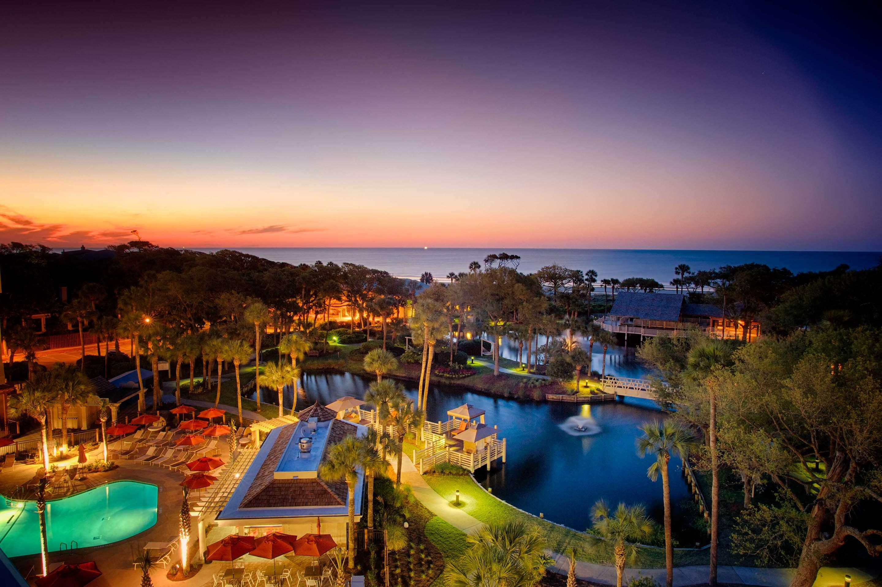 Sunset view of the Sonesta Resort Hilton Head with Atlantic Ocean in background